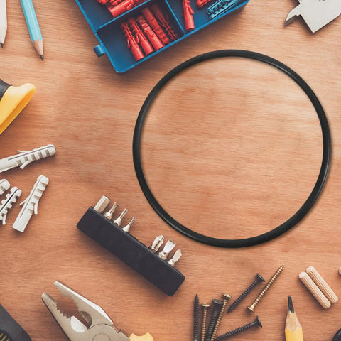 Built Tough Rubber Belt Pack For 770 And 900 Continuous Sealers on a workbench with tools and fasteners.