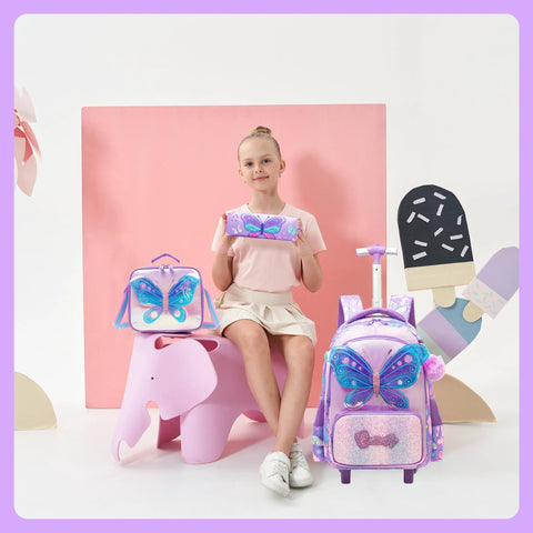 Girl with children's butterfly rolling backpack, lunch bag, and pencil case set
