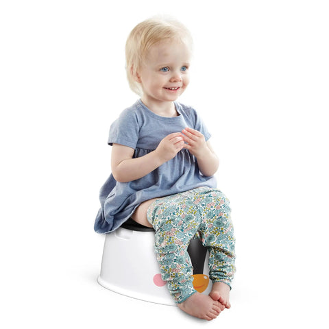 Nifty Toddler Potty Training Seat With A Cool Penguin Face And Sturdy Grasp Handles For Little Ones Featuring A child sitting happily on a potty.