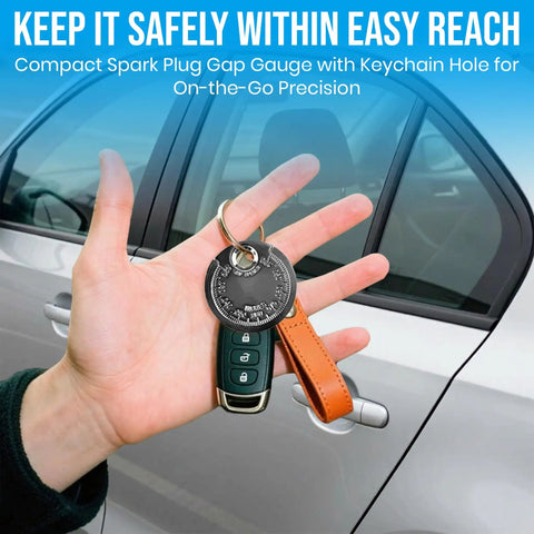 Hand holding car keys with a Three Pack Spark Plug Gap Gauge Tool For Mechanics attached, chrome finish, in front of car door