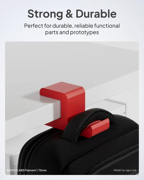 Top Shelf Abs 3D Printer Filament 1.75Mm Red 1Kg Spool used for a red hanging hook on a table holding a black bag.