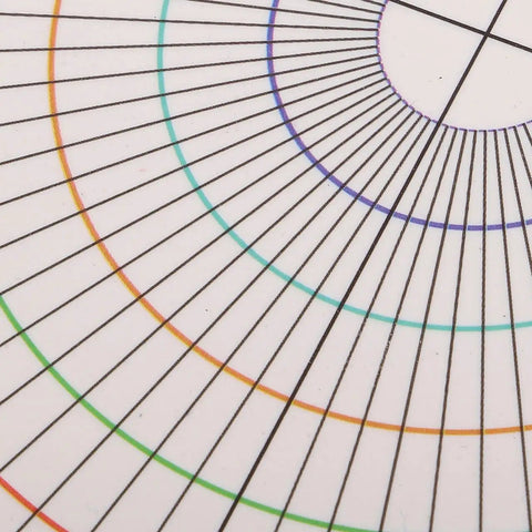 Close-up of Slick Circle Ruler And Pottery Layout Template For Dead-On Marking on Rotary Disc Trimmers, showing colorful concentric circle lines.
