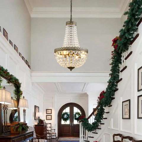 4 Light French Empire Mini Crystal Chandelier With Antique Brass Finish hanging in a foyer, elegant pendant lighting.