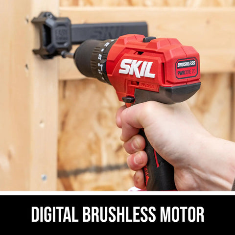 Hand using Hard Hitting 20V One Half Inch Hammer Drill Kit With 2.0Ah PWRCore 20 Battery And Charger on wood surface