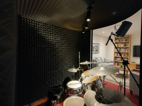 Twelve Pack High Density Pyramid Acoustic Foam Wall Panels With Strong Self Adhesive Backing Sound Proof Tile Blocks in a recording studio.