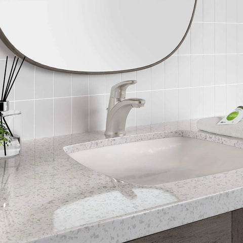 Colony Pro Single Handle Bathroom Faucet With Metal Pop Up Drain 1.2 GPM Brushed Nickel shown installed on vanity