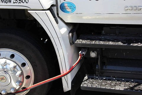 Heavy Duty Forklift Charging Plug With 50 Amp Split Connector And 10 Awg Cable connected to a truck, showcasing industrial power setup.