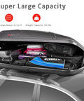 Rock Solid Rooftop Cargo Carrier Hard Shell Waterproof Gear Box featuring 14 cu ft of storage filled with various bags.