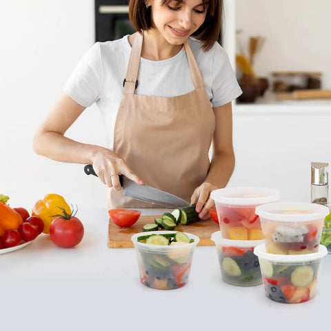 Woman preparing vegetables with Straight Up Solid 16 Oz Deli Containers With Lids 48 Sets Bpa Free Leakproof Soup Bowls Microwavable Freezer Safe And Dishwasher Ready For No Sweat Meal Prep Anytime You Want Some Good Eats.