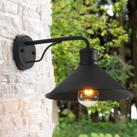 Matte black barn-style outdoor wall light, mounted on brick wall, part of 3 Pack Outdoor Wall Lights Wall Mount For Front Porch.