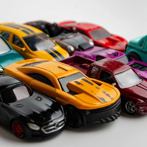 Colorful diecast cars arranged for Five Pack One Sixty Fourth Scale Wheels And Tires Set With Real Riders Rims And Axles For RC