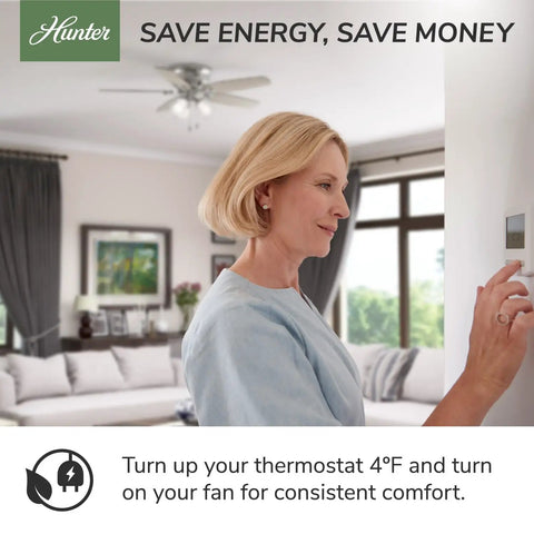 Woman adjusting thermostat with 42 Inch Indoor Ceiling Fan With LED Light Kit, Matte Black, 5 Blade in living room