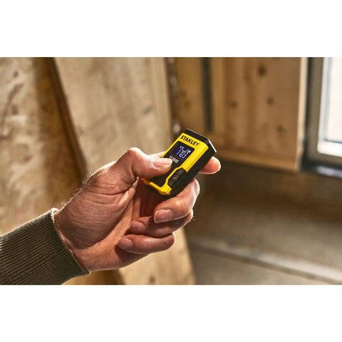 Laser Pocket Measure 12 m Handheld Distance Tool For Pros, Contractors, And DIYers, Compact And Durable Laser Measurer With Quick Readouts, Accurate Measurements, Ideal For Carpentry, Interior Design, And Renovations Model STHT77666-0 held in hand