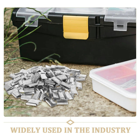 Heavy Duty Metal Banding Clip Buckle Set With Iron Seals For Packaging Strapping on concrete, toolbox in background