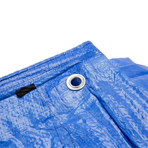 Close-up of blue Beefy Heavy Duty Poly Tarp 6x8 Waterproof with Grommets Every 36 Inches showing aluminum grommet