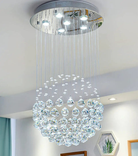 Six Light Crystal Chandelier Flush Mount Raindrop Ceiling Light With Large Ball Shape Design hanging in a modern room