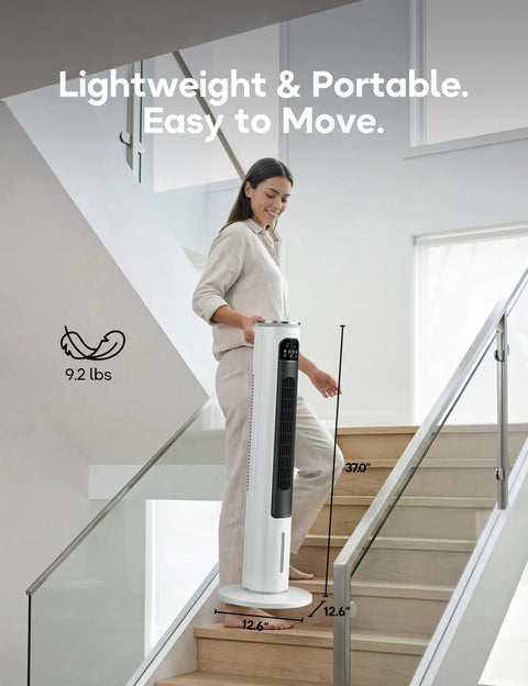 Woman carrying Portable AC Unit With Remote 37 Inch Ventless Evaporative Cooler Quiet Swamp Cooler up stairs, highlighting portability.