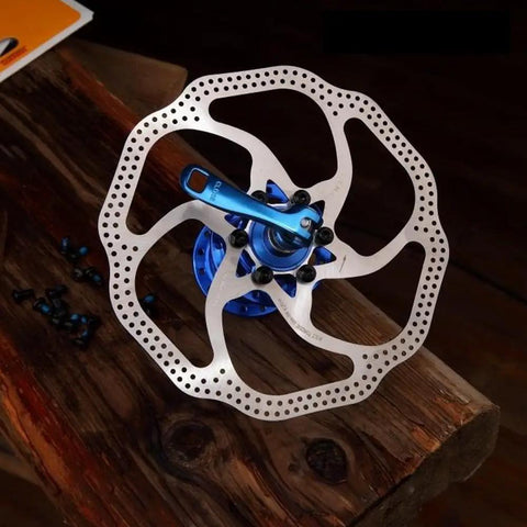 160mm 6 Bolt Stainless Disc Brake Rotor for Road, Mountain, MTB, BMX Bikes mounted on wooden surface