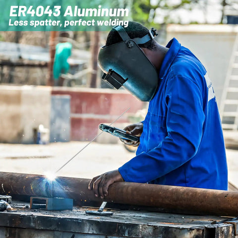 Welder using Sixty Pieces ER4043 Aluminum TIG Welding Rods One Sixteenth Inch By Sixteen Inch outdoors, demonstrating welding process.