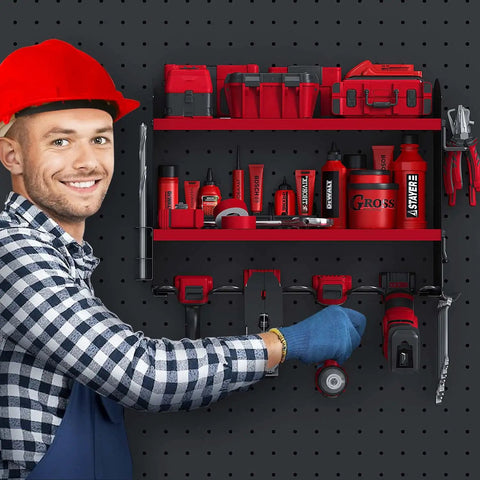 Man installing red Garage Power Tool Organizer Wall Mount Rack for Cordless Drills and Heavy Duty Storage on black wall.