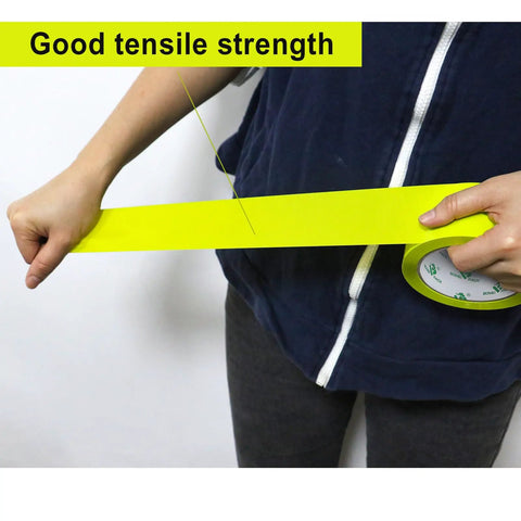 Person pulling Heavy Duty Light Yellow Packing Tape Refills, 2.5 Mil Thick for boxes, showcasing tensile strength
