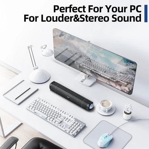 USB Computer Speakers With 3.5mm Aux, Wired USB Powered Sound Bar With Colorful LED Lights on a modern white desk setup