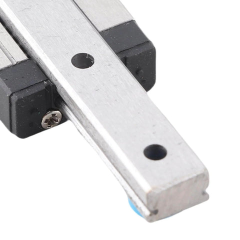 Close-up of 7mm Miniature Linear Rail Guide Slide Block LML7B with Lubrication System showing metal structure and mounting holes