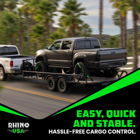 Badass Car Hauler Tie Down Straps Four Pack Two By Eight Foot Lasso Kit securing a truck on a flatbed trailer.