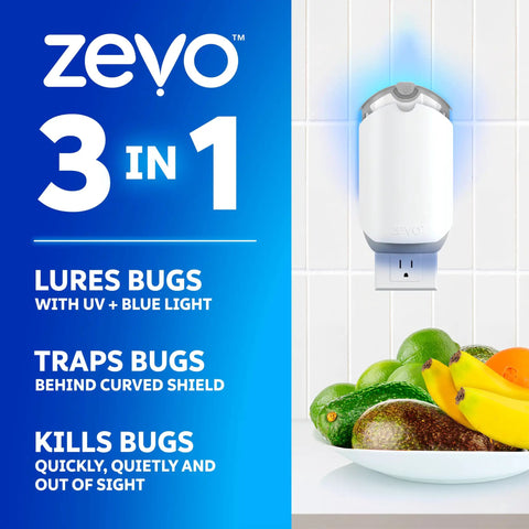 Plug In Bug Zapper For Straight Up Home Pest Control Killer Against Fruit Flies And Those Dang Gnats With UV Light and no mess adhesive cartridge on kitchen counter with fruits.