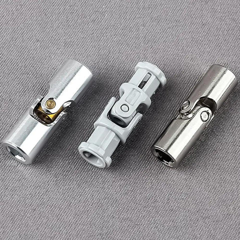 Three Upgraded Aluminum Alloy Universal Joints 3L in different finishes for Lego and MOC builds on a grey surface