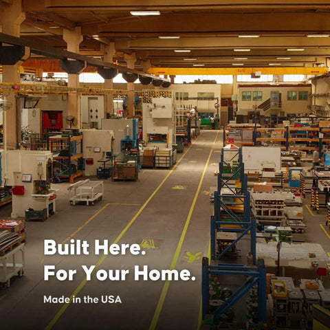 Interior of a manufacturing facility with "Built Here. For Your Home. Made in the USA" text in foreground