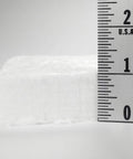 Ceramic fiber insulation, white, 1 in thick; side view with ruler.