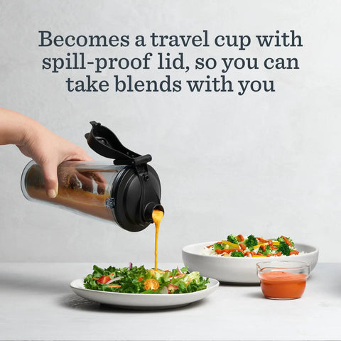 Pouring dressing from Personal Cup Adapter Kit For Full Size Blenders, BPA Free And Dishwasher Safe, into salad bowl