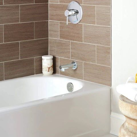 Concetto Tub Spout Starlight Chrome Half Inch Connection Drip Free Brass Bath Filler installed on modern bathroom wall