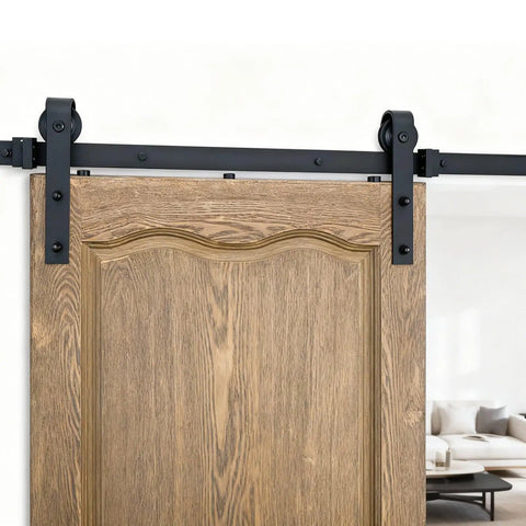 Upgrade Your Digs With This 6.6 Ft Black Sliding Barn Door Hardware Kit close-up of black rail and wooden door, perfect for interior use.