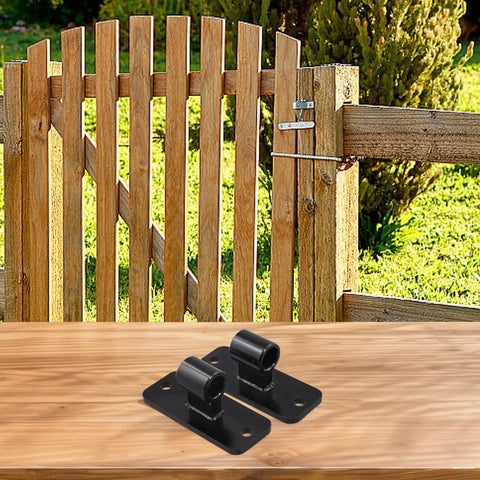 Galvanized Iron Gate Hinges For Five Eighth Inch Pin placed on wooden table in front of fence, wall mount hardware visible