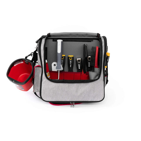 Pro Painters Tool Bag Deluxe with adjustable shoulder strap, open showing tools like brushes and rollers in various pockets.