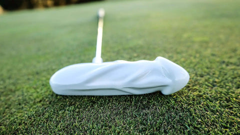 Pro Grade Premium Aluminum Head Putter With Chrome Stepless Shaft Stiff Graphite Build Ergonomic Rubber Grip White Finish High Precision Feel For Consistent Putts On The Green on a golf course close-up