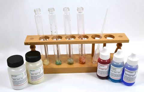Hands On Food Nutrients Chemistry Lab Kit For Classrooms To Test Carbs Lipids And Proteins Using Benedicts Solution Biuret Reagent Iodine And Fat Soluble Dye For 15 Student Groups with test tubes, reagents, and wooden holder.