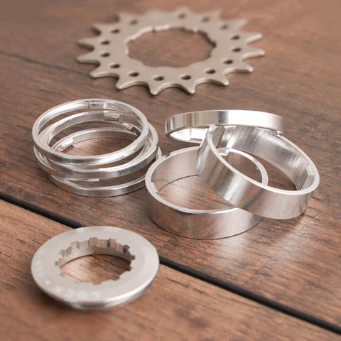 Single Speed Fixie Conversion Kit for mountain and road bikes with Shimano and SRAM cassette hubs, including spacers and 16T gear cog.
