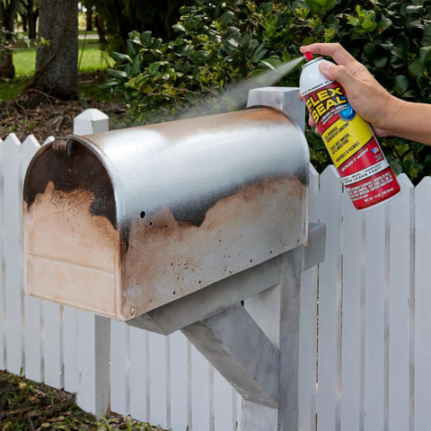 White 14 Oz Waterproof Rubber Spray On Sealant Coating That Stops Leaks Instantly Flexible After Drying Ideal For Gutters Wood RVs Campers Roofs Skylights Windows And More being applied to a metal mailbox.