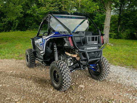 High Clearance Boxed Rear Radius Arms For Honda Talon 1000X And 1000X 4 2019 2020 Models With Seven Eighths Inch Adjustable Heim Joints High Strength Alloy Steel And Zinc Plated Chromoly Bushings For Tougher Smoother Handling. Rear view of Honda Talon with lifted suspension