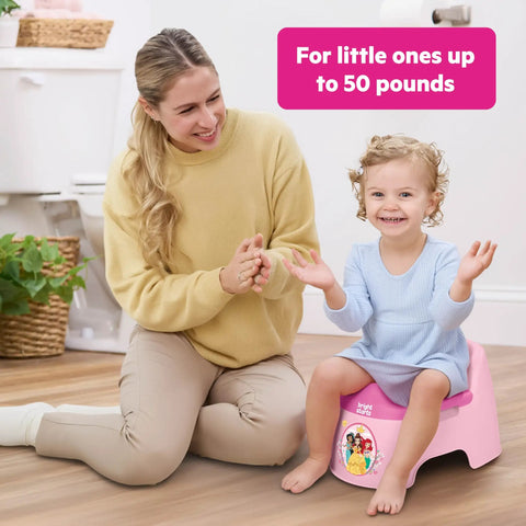 Disney Princess Toddler Potty Training Seat Big Kid Leap With Removable Bowl Splash Guard, toddler sitting happily with parent support.