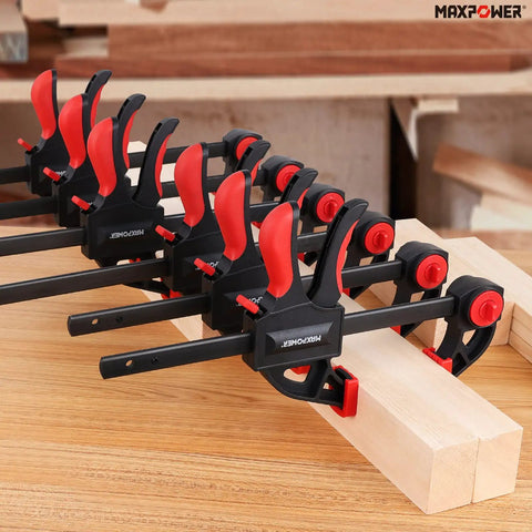 Heavy Duty Woodworking Bar Clamp Set, 12 Inch Two Pack And 6 Inch Two Pack, shown clamping wooden planks in workshop