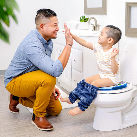 Ultra Comfy Toddler Potty Training Seat With Rock Solid Side Handles And Dead Simple Rinse Off Design Made In Usa, child using seat with parent.