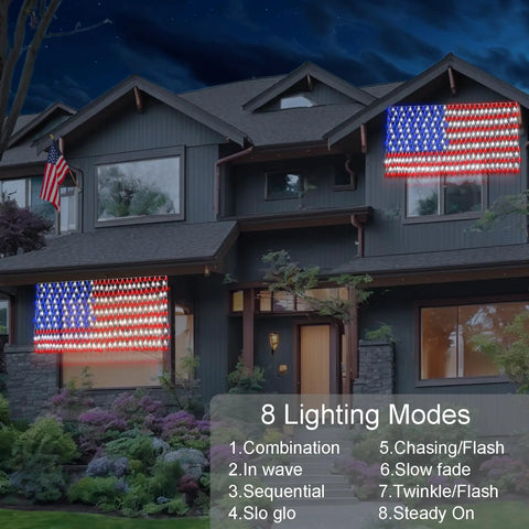Solar American Flag Net Lights Outdoor 420 LEDs 6.5ft By 3.28ft on house, illuminated at night with multiple lighting modes.