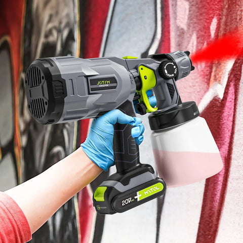 Person using Cordless HVLP Paint Sprayer With 2 Batteries And Charger, 3 Copper Nozzles And 3 Spray Patterns, 800ml Cup