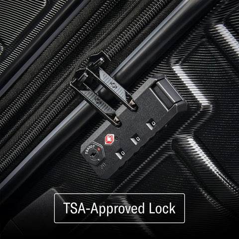 Close-up of TSA-approved lock on Samsonite expandable luggage set showcasing security features.