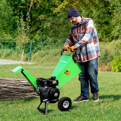 Man operating 7HP Gas Powered Wood Chipper With Three Inch Max Cutting Diameter All Steel Construction Beast Mode Heavy Duty Shredder Mulcher
