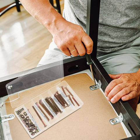 Person assembling furniture using 49Pcs M6 40 To 80Mm Hex Socket Head Screws And Barrel Nuts Grab And Go Kit